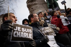 Slovenian journalists hold pens and placards reading in French "I am Charlie" during a gathering in tribute of victims of the attack on French satirical weekly Charlie Hebdo, on January 8, 2015 in Ljubljana, a day after two gunmen killed 12 people in an Islamist attack at Charlie Hebdo's editorial office in Paris. The massacre, the country's bloodiest attack in half a century, triggered poignant and spontaneous demonstrations of solidarity around the world. Charlie Hebdo is famed for its irreverent views of religion and its decision to publish controversial cartoons of the prophet Mohammed. AFP PHOTO / JURE MAKOVEC