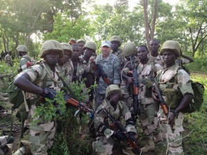 A California National Guard Special Forces soldier from Los Alamitos-based Special Operations Detachment-U.S. Northern Command and Company A, 5th Battalion, 19th Special Forces Group (Airborne), poses with Nigerian soldiers on May 31, 2014, during a training mission in Nigeria.