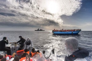 June 7, 2014 - Mediterranean Sea / Italy: Refugees rescued off a boat and carried onto an Italian navy ship on a mission to seek asylum seekers fleeing Africa and the Middle east through Libya. More than 2,000 migrants jammed in 25 boats arrived in Italy June 12, ending an international operation to rescue asylum seekers traveling from Libya. They were taken to three Italian ports and likely to be transferred to refugee centers inland. Hundreds of women and dozens of babies, were rescued by the frigate FREMM Bergamini as part of the Italian navy's "Mare Nostrum" operation, launched last year after two boats sank and more than 400 drowned. Favorable weather is encouraging thousands of migrants from Syria, Eritrea and other sub-Saharan countries to arrive on the Italian coast in the coming days. Cost of passage is in the 2,500 Euros range for Africans and 3,500 for Middle Easterners, per person. Over 50,000 migrants have landed Italy in 2014. Many thousands are in Libya waiting to make the crossing. (Massimo Sestini/Polaris)