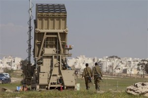 Israeli soldiers walk next to the Iron Dome, a new anti-rocket system, near the southern Israeli city of Beersheba, Sunday, March 27, 2011. Weeks of stepped-up rocket and mortar attacks have drawn fears of renewed war and led to new calls in Israel for the military to deploy the $200 million Iron Dome anti-rocket system. The Israeli military said the system began operating on Sunday near Beersheba, southern Israel's largest city. (AP Photo/Oded Balilty)