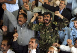 epa01774618 A member of Iranian revolutionary guard shouts slogans during the Friday prayer ceremony in Tehran, Iran, on 26 June 2009. Iranian Ayatollah Ahmad Khatami called on the judiciary to issue, 'without any mercy,' death sentence against the leaders of the recent protest demonstrations against alleged fraud in the June 12 presidential election, as according to Islamic laws, anybody attacking the ruler ship with warm or cold weapons will have to face the capital punishment. State media reported eight members of the pro-Ahmadjniead voluntary Basij militia have been killed during the recent clashes between police and demonstrators. At least 17 demonstrators were killed as well.  EPA/ABEDIN TAHERKENAREH