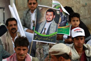 Yemeni supporters of the Shiite Huthi movement hold a portrait of the movement's leader Abdul-Malik al-Houthi during a demonstration against what they call foreign interference in Yemeni politics on February 27, 2015 in the capital Sanaa. Yemen's President Abedrabbo Mansour Hadi met on February 26, 2015 with UN envoy Jamal Benomar in Aden, as the southern city increasingly became the country's de facto political and diplomatic capital instead of militia-held Sanaa. AFP PHOTO / MOHAMMED HUWAIS