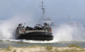 An air-cushion vehicle goes toward the beach as NATO troops participate in the NATO sea exercises BALTOPS 2015 that are to reassure the Baltic Sea region allies in the face of a resurgent Russia, in Ustka, Poland, Wednesday, June 17, 2015.(AP Photo/Czarek Sokolowski)