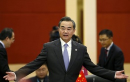 China's Foreign Minister Wang Yi gestures as he arrives at a China ministerial meeting at the 48th Association of Southeast Asian Nations (ASEAN) foreign ministers meeting in Kuala Lumpur, Malaysia, August 5, 2015. REUTERS/Olivia Harris