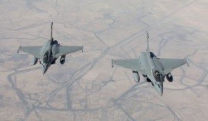 A handout picture taken by EMA and released on September 15, 2014 by ECPAD shows two Rafale fighter jets flying on a reconnaissance mission over Iraq after taking off from the Al-Dhafra base in the United Arab Emirates. The world's top diplomats pledged on September 15 to support Iraq in its fight against Islamic State militants by "any means necessary", including "appropriate military assistance", as leaders stressed the urgency of the crisis. Representatives from around 30 countries and international organisations, including the United States, Russia and China, gathered in Paris as the savage beheading over the weekend of a third Western hostage raised the stakes in the battle against the marauding jihadists.   AFP PHOTO / ECPAD / EMA /ARMEE DE L'AIR = RESTRICTED TO EDITORIAL USE - MANDATORY CREDIT "AFP PHOTO / ECPAD / EMA /ARMEE DE L'AIR" - NO MARKETING NO ADVERTISING CAMPAIGNS - DISTRIBUTED AS A SERVICE TO CLIENTS - TO BE USED WITHIN 30 DAYS FROM 09/15/2014 =