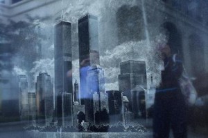 People are reflected in a Memorial Monument during events marking the 11th anniversary of the 9/11 attacks on the World Trade Center in Exchange Place in New Jersey, September 11, 2012. REUTERS/Eduardo Munoz (UNITED STATES - Tags: DISASTER ANNIVERSARY CITYSPACE TPX IMAGES OF THE DAY) - RTR37V1A