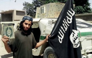 An undated photograph of a man described as Abdelhamid Abaaoud that was published in the Islamic State's online magazine Dabiq and posted on a social media website. A Belgian national currently in Syria and believed to be one of Islamic State's most active operators is suspected of being behind Friday's attacks in Paris, acccording to a source close to the French investigation. "He appears to be the brains behind several planned attacks in Europe," the source told Reuters of Abdelhamid Abaaoud, adding he was investigators' best lead as the person likely behind the killing of at least 129 people in Paris on Friday. According to RTL Radio, Abaaoud is a 27-year-old from the Molenbeek suburb of Brussels, home to other members of the militant Islamist cell suspected of having carried out the attacks.  REUTERS/Social Media Website via Reuters TVATTENTION EDITORS - THIS PICTURE WAS PROVIDED BY A THIRD PARTY. REUTERS IS UNABLE TO INDEPENDENTLY VERIFY THE AUTHENTICITY, CONTENT, LOCATION OR DATE OF THIS IMAGE. FOR EDITORIAL USE ONLY. NOT FOR SALE FOR MARKETING OR ADVERTISING CAMPAIGNS. FOR EDITORIAL USE ONLY. THIS PICTURE WAS PROCESSED BY REUTERS TO ENHANCE QUALITY.