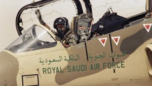 A pilot of the Royal Saudi Air Force waves to ground personnel to take off in his American made F-15 Eagle Fighter Jet on Wednesday, August 15, 1990 at an Air Base in Saudi Arabia. The Saudi Air Force is being augmented by American Air Power as they prepare to defend against the Iraqi military threat. (AP Photo/Scott Applewhite)