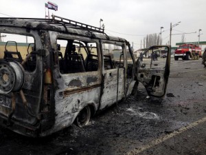 A view shows a burnt vehicle near a damaged traffic checkpoint near the town of Derbent in Dagestan's southeast, Russia, February 15, 2016. REUTERS/Stringer