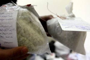 Syrian police show seized drugs and captagon pills at the Drug Enforcement Administration in the capital Damascus, on January 4, 2016. A string of major drug busts in Syria and Lebanon has drawn new attention to the trade in captagon, an illegal substance that has flourished in the chaos of Syria's war. Security forces in both countries have clamped down in recent months on exports of the psychostimulant, produced in swathes of Syrian and Lebanese territory where government oversight is lax or non-existent.  / AFP / LOUAI BESHARA        (Photo credit should read LOUAI BESHARA/AFP/Getty Images)