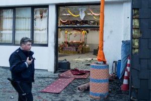 A police officer walks in front of the Sikh temple in Essen, western German where an explosion took place at a wedding on April 16, 2016. German police arrested two teenagers with Islamist backgrounds on April 21, 2016 over an explosion that wounded three people at a Sikh temple, labelling it a "terrorist attack". / AFP / dpa / Marcel Kusch / Germany OUT        (Photo credit should read MARCEL KUSCH/AFP/Getty Images)