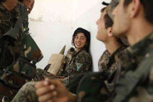 Fighters from the Kurdish People's Protection Units (YPG), part of the Syrian Democratic Forces (SDF), are seen in the village of Fatisah in the northern Syrian province of Raqa on May 25, 2016.  US-backed Syrian fighters and Iraqi forces pressed twin assaults against the Islamic State group, in two of the most important ground offensives yet against the jihadists. The Syrian Democratic Forces (SDF), formed in October 2015, announced on May 24 its push for IS territory north of Raqa city, which is around 90 kilometres (55 miles) south of the Syrian-Turkish border and home to an estimated 300,000 people. The SDF is dominated by the Kurdish People's Protection Units (YPG) -- largely considered the most effective independent anti-IS force on the ground in Syria -- but it also includes Arab Muslim and Christian fighters.  / AFP PHOTO / DELIL SOULEIMAN