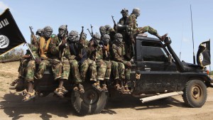 Members of al Shabaab, al Qaeda-linked insurgents, ride in a pick-up truck after distributing relief to famine-stricken internally displaced people at Ala Yaasir camp at Km50 outside Somalia's capital Mogadishu, September 3, 2011. More than 800,000 Somalis are refugees, according to U.N. estimates, while up to 1.5 million are displaced within the Horn of Africa country. Picture taken September 3, 2011. REUTERS/Feisal Omar (SOMALIA - Tags: SOCIETY CIVIL UNREST POLITICS)