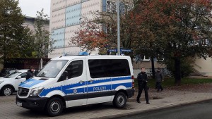 epa05601849 A police vehicle stands in front of a residential building as an anti-terror operation is taking place in Jena, Germany, 25 October 2016. According to a statement by the State Office of Criminal Investigations, 12 apartments and a shared accommodation were raided across Germany. Operations were carried out simultaneously in Thuringia, Hamburg, Northrhine-Westphalia, Saxony and Bavaria.  EPA/BODO SCHACKOW