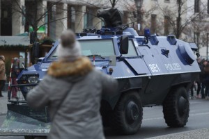 BERLIN, GERMANY - DECEMBER 23:  TA visitor walk past a police armoured vehicle near the Brandenburg Gate prior to a concert there on December 23, 2016 in Berlin, Germany. German authorities remain on high alert following the shooting of terror suspect Anis Amri by Italian police in Milan. Amri, who is thought to be the driver who drove a truck into a Berlin Christmas market on December 19, killing 12 people and injuring dozens, possibly had accomplices in the Berlin Islamist scene.  (Photo by Sean Gallup/Getty Images)