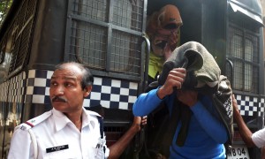 Indian police officials escort Japanese student rape acccused to the Bankshall court in Kolkata on January 9, 2015. Police in India's eastern city of Kolkata have arrested several suspects for allegedly kidnapping and holding a young Japanese student for weeks while they repeatedly raped her. The unidentified woman was abducted from a village near Bodh Gaya, one of Buddhism's most sacred sites, located about 80 miles south of Patna.   AFP PHOTO / Dibyangshu SARKAR        (Photo credit should read DIBYANGSHU SARKAR/AFP/Getty Images)