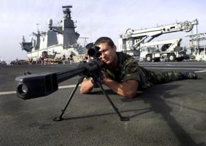 A Royal Marine from 40 Commando practises his sniper skills12 March 2003, with a Barrett.50 rifle on the deck of HMS Ocean as it travels through the Gulf.  AFP PHOTO POOL/JONATHAN BUCKMASTER / AFP PHOTO / POOL / JONATHAN BUCKMASTER