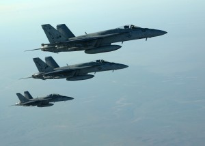 In this Tuesday, Sept. 23, 2014 photo released by the U.S. Air Force, a formation of U.S. Navy F-18E Super Hornets leaves after receiving fuel from a KC-135 Stratotanker over northern Iraq, as part of U.S. led coalition airstrikes on the Islamic State group and other targets in Syria. U.S.-led airstrikes targeted Syrian oil installations held by the militant Islamic State group overnight and early Thursday, Sept. 25, 2014, killing nearly 20 people as the militants released dozens of detainees in their de facto capital, fearing further raids, activists said. (AP Photo/U.S. Air Force, Staff Sgt. Shawn Nickel)
