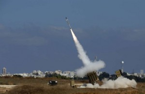 An Iron Dome launcher fires an interceptor rocket in the southern Israeli city of Ashdod July 9, 2014. At least two rockets fired from the Gaza Strip at Tel Aviv on Wednesday were shot down mid-air by Israel's Iron Dome defense system, the Israeli military said. REUTERS/Baz Ratner (ISRAEL - Tags: POLITICS MILITARY CIVIL UNREST CONFLICT TPX IMAGES OF THE DAY) - RTR3XQYZ
